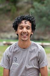 young man in front of green background